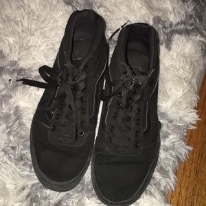 All black high top Vans